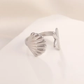 Macro shot of silver stainless steel open ring featuring seashell and starfish details - Steel Color Shell Starfish