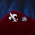 Classic silver metal fleur-de-lis lapel pin badge with butterfly clutch on red velvet - Silver Fleur-de-lis