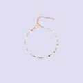 Polished gold lip chain with white enamel oval beads and lobster clasp closure detail - Gold + White