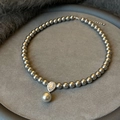 Detail of grey pearl necklace with a teardrop crystal pendant on velvet tray - Dark Grey Pearl Necklace with Water Drop Rhinestone Pendant (Style 17)