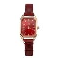 Close-up of red rectangular dial and magnetic Milanese strap on a rose gold quartz watch - Red