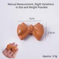Mini orange bow-knot PU bread model, soft slow rebound toy measuring 5cm by 3.8cm - Mini Bowknot Pretzel