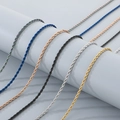 Detail of twisted rope chains in multiple colors hanging on a light grey cylinder stand - Rope Chain Necklace / 50cm / Steel