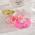 Pink cat paw keychain with colorful floating beads and golden metal ring charm - Bead Paw Style / Pink