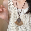 Close-up of vintage bronze bohemian necklace with circular pendant and brown tassels - Light Coffee Round Style (4#)