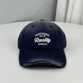 Distressed navy blue baseball cap with white embroidered letters and frayed brim detail. - One Size (58-60cm) / Navy Blue