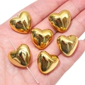 Perline in acrilico dorato a forma di cuore sul palmo che mostrano misura e riflesso - Oro Liscio (20x18mm)