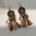 Macro detail of bohemian fringe earrings with vintage metal discs and natural shells - Brown and Beige Tassel Shell Style(E6315)