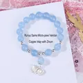 Light blue beaded bracelet with shell pearl charm in copper and cubic zirconia - Aquamarine Blue Shell