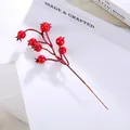 Detailed view of glossy red artificial berries on branches for home and festive decor - Red 8 Pomegranate Berries