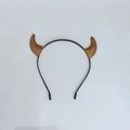 Detail view of gold sequin devil horns headband with a slim black plastic band - Orange Glitter Small Horn