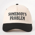 Retro contrast color baseball cap featuring Somebody's Problem embroidery in cream and black - Cream/Black