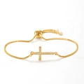 Close-up of golden cross bracelet with cubic zirconia inlay and adjustable slider clasp - Style 3 / 18K Gold