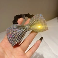 Detail of high-elasticity hair tie featuring a sparkling bow with iridescent rhinestones - Style D Scrunchie / AB Color