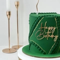 Macro shot of green velvet cake featuring gold geometric lines and acrylic Happy Birthday topper - Design No.5 / Gold