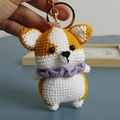Handmade crochet corgi keychain in yellow and white yarn with a purple collar accent - Corgi with Purple Scarf