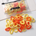 Élastiques à cheveux jaunes et orange avec pochette de rangement mate motif canard - Ensemble de 100 pièces / Série Jaune