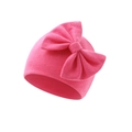 Close-up of bright pink knitted baby hat with a large bow and fine ribbed texture - Rose Red (Bow Turban Hat)