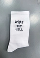 White athletic crew socks with bold black What The Hell knitted lettering style - What The Hell