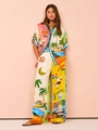 Detail of colorful printed casual two-piece set featuring wide leg trousers and shirt - Coconut Tree Pattern