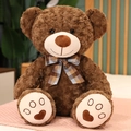 Dark brown teddy bear plush with a plaid bow tie and heart-patterned embroidery on paws - Cocoa Brown