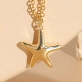 Elegant gold starfish pendant necklace with cubic zirconia for women in ocean style - Smooth Sea Star