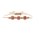 Handmade woven bracelet featuring pink ceramic flowers and gold metallic beads on beige cord - Copper Beads + Peach Pink Flowers