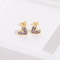 Elegant gold heart earrings set with purple gemstones on a clean white textured surface - Purple (ES0041)