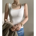 Slim fit white cotton knit tank top for women styled with a casual jacket and denim - White