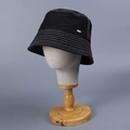 Detail of black canvas bucket hat with decorative multi-row stitching and a gold logo - M(56-58cm) / Black