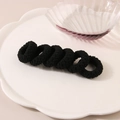 Set di 6 elastici per capelli jacquard neri in tessuto spugna su un piatto - Nero