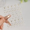 Detail of champagne gold moon and star nail stickers with metallic finish, model C7301 - C7301 / Champagne Gold