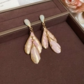 Close-up of gold leaf earrings with pink and cyan enamel in a brown velvet jewelry box - Gold-Blue-Pink