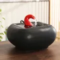 Modern black ceramic pet water fountain with vibrant red faucet for home interior decor - Flowing Water Wealth [Red Top-Black Bottom]