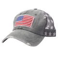 Close-up of American flag embroidery and distressed denim texture on grey baseball cap - Gray