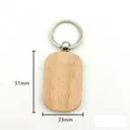 Detail of beech wood keychain showing 51mm x 33mm dimensions and 13g weight for DIY - Rounded Rectangular Style (Style 9)