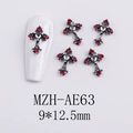 Detailed view of silver Gothic cross nail charm with a heart center and red rhinestones - AE63-Red Gem Cross