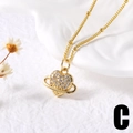 Golden heart-shaped Saturn pendant necklace with sparkling cubic zirconia stones - C-Heart Saturn