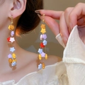 Macro shot of long star-shaped bead tassel earrings with colorful glass beads and gold studs - 27# Silver Earring Post - Multicolor
