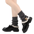 Detail of dark grey knit leg warmers with beige lace trim and two wooden buttons - One Size / Dark Gray