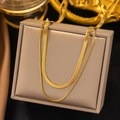 Elegant double-layered gold snake chain necklace displayed on a luxury jewelry box - AH489 Blade + Round Snake / Gold