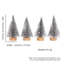 Miniature flocked Christmas trees with golden bells and wooden base in 4-piece set - Set of 4 / Silver with Snow