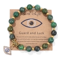 Ethnic beaded bracelet with green turquoise stones, gold spacers, and Evil Eye charm - 19cm / African Pine Stone