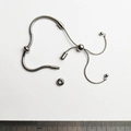 Detail view of silver snake chain bracelet with adjustable slide clasp and threaded end - Bracelet With 2 Beads / Steel