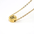Golden stainless steel necklace featuring a round Taurus zodiac symbol pendant in minimalist style - Taurus