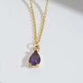 Detail of elegant purple teardrop pendant with gold chain and claw setting - Purple