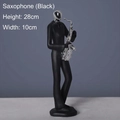 Modern black saxophone player figurine sculpture with silver accents, 28cm height - Silver-Saxophone