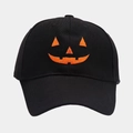 Detailed view of orange Jack-o'-lantern pumpkin embroidery on a black baseball cap - Adjustable / Black