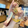Brown silicone strap keychain with yellow liquid ball charm and bear milk tea theme - Bear Milk Tea - Lollipop Shape