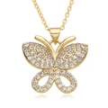 Gold butterfly pendant necklace with shimmering zircon crystals on white background - F233
